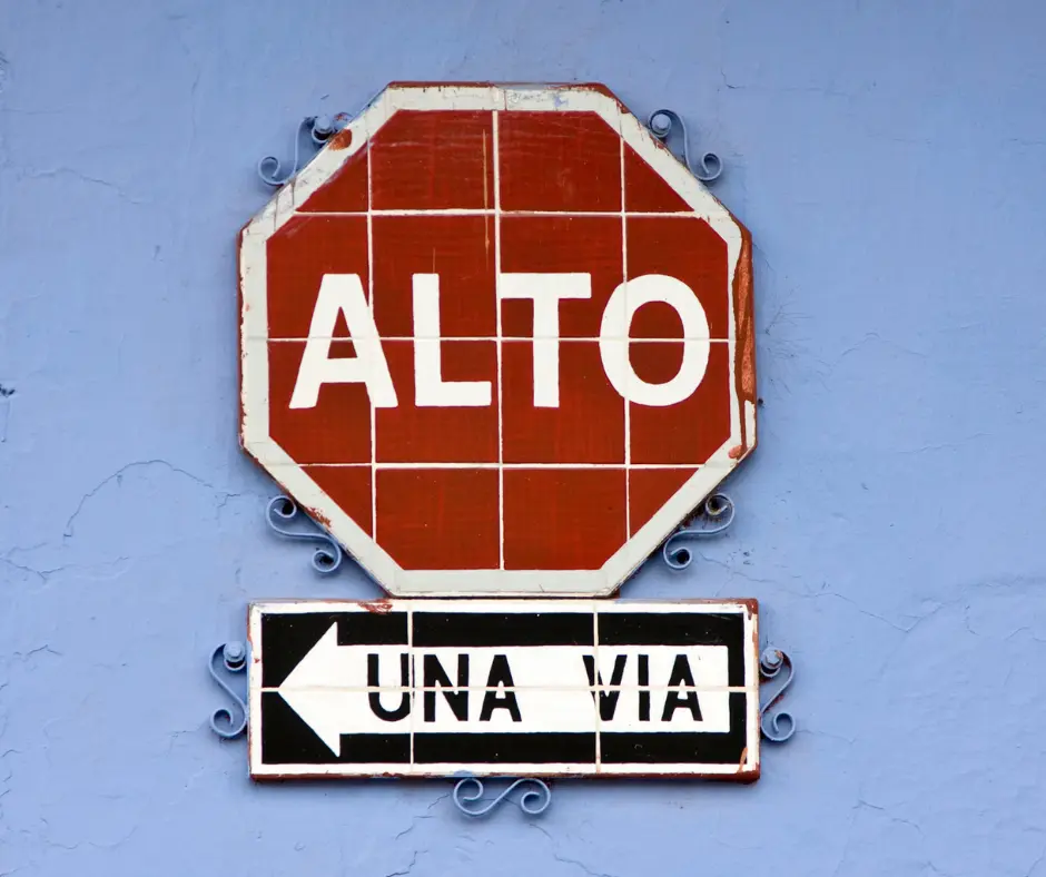 renting a car in Cancun stop sign