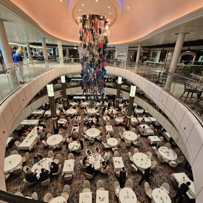 a group of people sitting at table on odyssey of the Seas